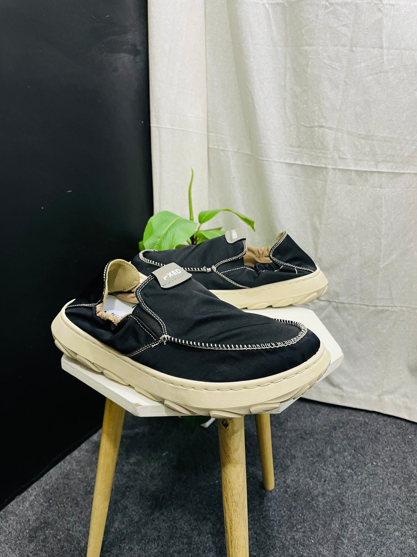 Black Slip-On Shoes with White Stitching and Off-White Sole – Elegant and Versatile