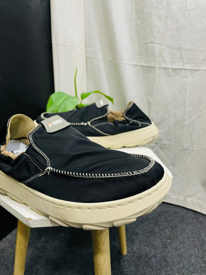 Black Slip-On Shoes with White Stitching and Off-White Sole – Elegant and Versatile